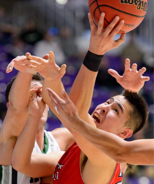 Trent Nelson  |  The Salt Lake Tribune
East's Dacian Spotted Elk reaches for a loose ball as East faces Olympus High School in the state 4A boys basketball tournament at the Dee Events Center in Ogden, Tuesday February 24, 2015.