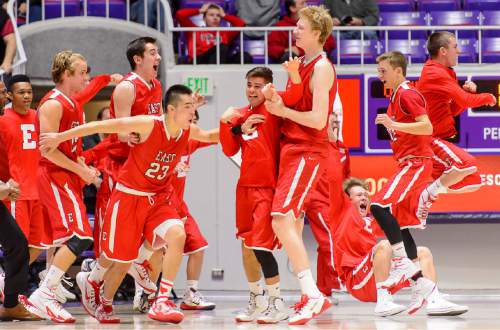 Trent Nelson  |  The Salt Lake Tribune
East's Dacian Spotted Elk celebrates a three-pointer at the buzzer to put the game into overtime as East faces Olympus High School in the state 4A boys basketball tournament at the Dee Events Center in Ogden, Tuesday February 24, 2015.