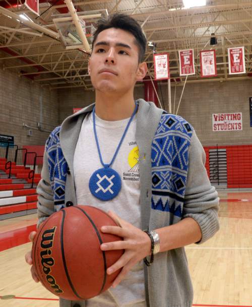 Al Hartmann  |  The Salt Lake Tribune
East High School guard Dacian Spotted Elk is one of the bright talents in the state of Utah, but he also representing his heritage as a Native American on the basketball court.