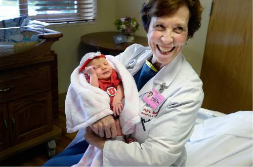 Scott Sommerdorf   |  The Salt Lake Tribune
Dr. Vicki L. Macy, MD, OBGYN, holds Candace and Chris Horne's newborn Brinley Horne who she delivered at Salt Lake Regional Medical Center, Wednesday, September 30, 2015.