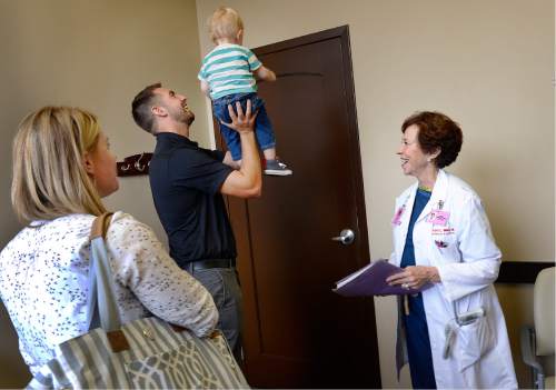 Scott Sommerdorf   |  The Salt Lake Tribune
Two year old Ryan Wangsgard, held up by his father David, leave their last appointment with Dr. Vicki L. Macy, MD, OBGYN, as Ryan's mother Sarah watches at left, at Salt Lake Regional Medical Center, Wednesday, September 30, 2015.