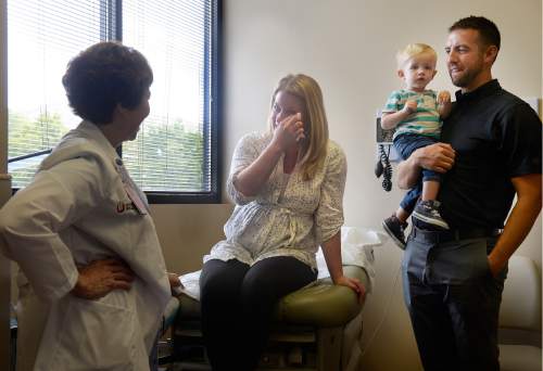 Scott Sommerdorf   |  The Salt Lake Tribune
Sarah Wangsgard wipes away some tears as she talks with Dr. Vicki L. Macy, MD, OBGYN, during the last pregnancy check-in they'll have with Macy at Salt Lake Regional Medical Center, Wednesday, September 30, 2015. Dr. Macy also delivered the Wangsgard's son, Ryan being held by his father.