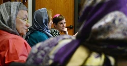 Steve Griffin  |  The Salt Lake Tribune

Rabbi Ilana Schwartzman, center, listens during a Social Action Network meeting at Congregation Kol Ami in Salt Lake City, Friday, December 18, 2015.  The women in the meeting were wearing headscarves in solidarity with the Muslim community.