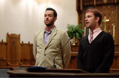 Francisco Kjolseth | The Salt Lake Tribune
Michael Adam Ferguson, left, and his husband J Seth Anderson, repeat the joyful Aramaic exclamation of praise, "hosanna, hosanna, hosanna, for justice and peace for all" concluding a Christmas interfaith service is held at St. Paul's Episcopal Church in Salt Lake to affirm the dignity and worth of all people. The service, titled "Seeing Christ In Every Child," was prompted by ongoing spiritual isolation and pain expressed by LGBTQ people of faith.