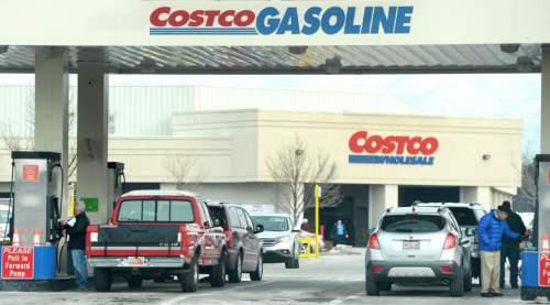 Steve Griffin  |  The Salt Lake Tribune

 Motorists fill up their cars at the Costco gas station in Salt Lake City, Monday, December 28, 2015.
