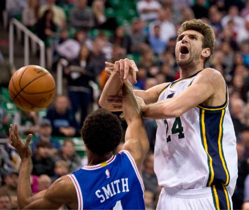 Lennie Mahler  |  The Salt Lake Tribune

Jazz center Jeff Withey draws a foul from Ish Smith in the first half of a game against the Philadelphia 76ers at Vivint Smart Home Arena, Monday, Dec. 28, 2015.