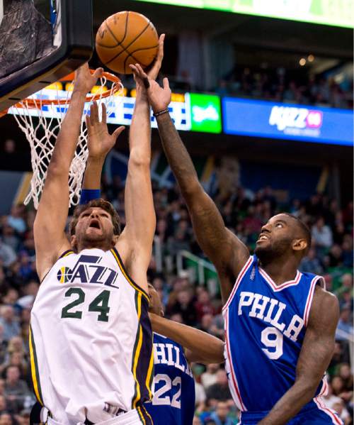 Lennie Mahler  |  The Salt Lake Tribune

Jazz center Jeff Withey is fouled on a rebound by JaKarr Sampson in the first half of a game against the Philadelphia 76ers at Vivint Smart Home Arena, Monday, Dec. 28, 2015.