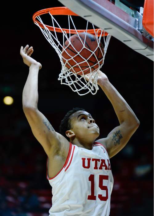 Francisco Kjolseth | The Salt Lake Tribune
Utah Utes guard Lorenzo Bonam (15) drops a ball in the basket while battling the College of Idaho in game action at the Huntsman Center on Monday night in the final non-conference game of the season.