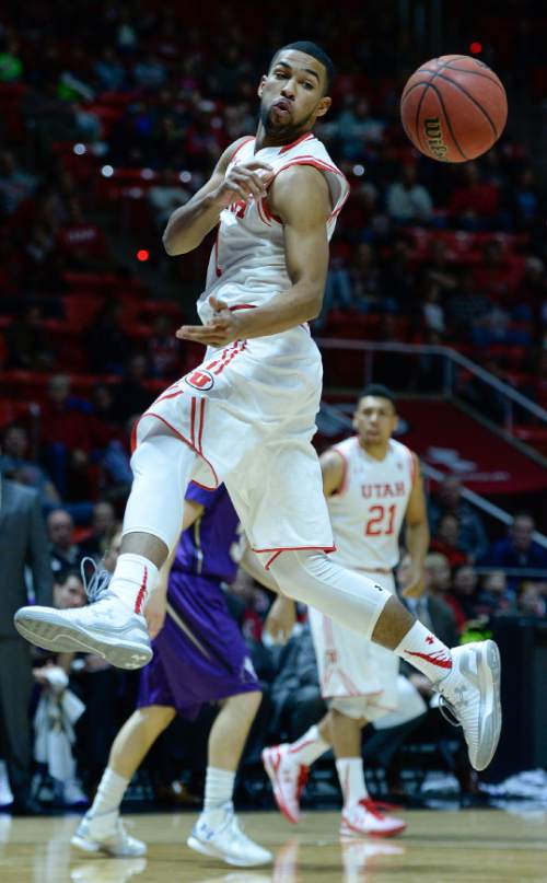 Francisco Kjolseth | The Salt Lake Tribune
Isaiah Wright passes the ball in game action at the Huntsman Center on Monday night in the final non-conference game of the season.