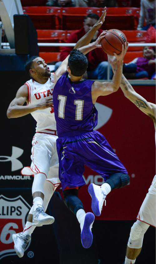 Francisco Kjolseth | The Salt Lake Tribune
Idaho Yotes guard Aitor Zubizarreta (11) pushes past the Utah defense in game action at the Huntsman Center on Monday night in the final non-conference game of the season.