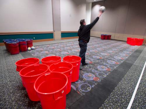 Steve Griffin  |  The Salt Lake Tribune

 EVE creative director Topher Horman plays a game in the "not your parents" game room which is the newest attraction at this year's EVE Winterfest, which starts Tuesday, Dec. 29, The room includes giant games like checkers, dominoes and Jenga, but  also re-creates a giant living room where people can play play video games, specifically Minecraft, using laptops provided or there own devices. Workers began setting up for the event Monday morning at the Salt Palace Convention Center in Salt Lake City, Monday, December 28, 2015.