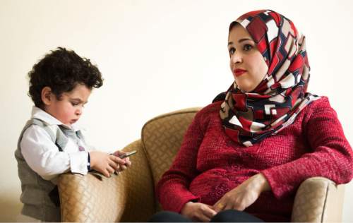 Steve Griffin  |  The Salt Lake Tribune

Two-year-old Ridha Alhareb and his mother, Sarah Alsahyem, in their home in Millcreek on Friday, Dec. 18, 2015. Mohammed Alhareb, wife Sarah and son Ridha have been in Utah for nine months since leaving Iraq.