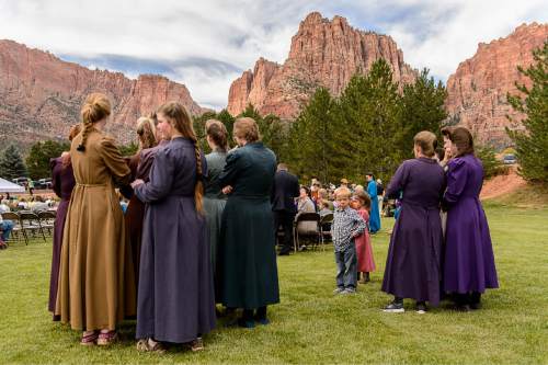 Trent Nelson  |  The Salt Lake Tribune
Attendees at a memorial for the 13 (and 1 still missing) victims of a September 14th flash flood. The memorial was held in Maxwell Park in Hildale, Saturday September 26, 2015.