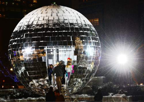 Steve Griffin  |  The Salt Lake Tribune

Visitors step inside the giant mirror ball on the south plaza of the Salt Palace Convention Center as EVE Winter Fest, Salt Lake City's three-day end-of-the-year celebration, opens Tuesday, December 29, 2015.
