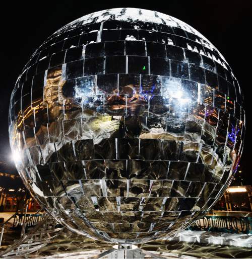 Steve Griffin  |  The Salt Lake Tribune

Visitors step inside the giant mirror ball on the south plaza of the Salt Palace Convention Center as EVE Winter Fest, Salt Lake City's three-day end-of-the-year celebration, opens Tuesday, December 29, 2015.