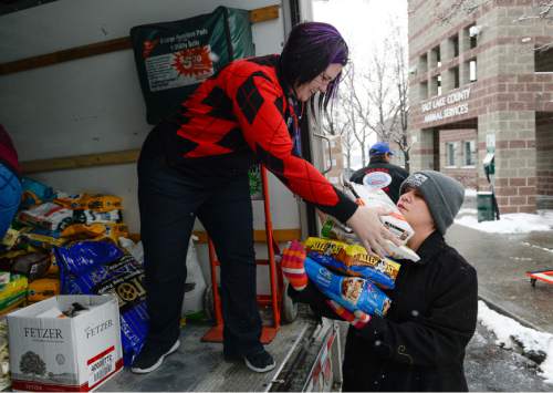 Francisco Kjolseth | The Salt Lake Tribune
Rachel Hopper, left, and Kiera Packer, unload a truck full of pet supplies at the Salt Lake County Animal Services on Tuesday. A three month holiday drive culminated with the delivery which will be used to support animal services locally.