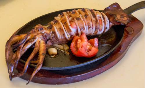 Rick Egan  |  The Salt Lake Tribune

The grilled pusit ($12.95), a whole squid, stuffed with fresh tomatoes at Queen Asia, a new Filipino/Vietnamese restaurant in West Jordan.