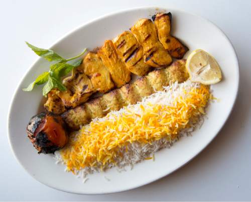 Rick Egan  |  The Salt Lake Tribune

The Chicken Soltani plate includes two chicken skewers (one ground chicken the other marinated and charbroiled) served with rice and grilled tomato at the Zaferan Cafe, in Cottonwood Heights.