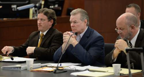 Francisco Kjolseth  |  The Salt Lake Tribune 
A new murder trial begins for Douglas Anderson Lovell, 57, center, charged with aggravated murder for allegedly kidnapping and killing 39-year-old Joyce Yost in 1985 to keep her from testifying against him in a rape case. Lovell who appeared in 2nd District Court, in Ogden on Monday, March, 16, 2015, is seen facing into the courtroom gallery where the jury was being selected for his trial.