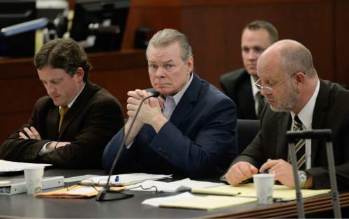 Francisco Kjolseth  |  The Salt Lake Tribune 
A new murder trial begins for Douglas Anderson Lovell, 57, center, charged with aggravated murder for allegedly kidnapping and killing 39-year-old Joyce Yost in 1985 to keep her from testifying against him in a rape case. Lovell who appeared in 2nd District Court, in Ogden on Monday, March, 16, 2015, is seen facing into the courtroom gallery where the jury was being selected for his trial.