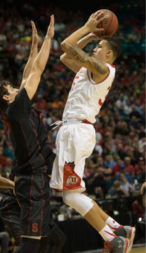 Rick Egan  |  The Salt Lake Tribune

Utah Utes guard Kenneth Ogbe (25) shoots over Stanford Cardinal forward Rosco Allen (25), in Pac-12 Basketball Championship action Utah vs. Stanford, at the MGM Arena, in Las Vegas, Thursday, March 12, 2015.