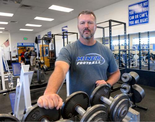 Al Hartmann  |  The Salt Lake Tribune
Dave Peck, Bingham football coach, works out in the high school's weight room.  He has been the state's top high school football coach the past few years.