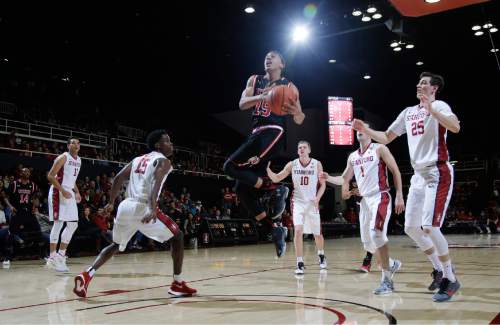Utah guard Lorenzo Bonam (15) drives to the basket against Stanford during the first half of an NCAA college basketball game Friday, Jan. 1, 2016, in Stanford, Calif. (AP Photo/Marcio Jose Sanchez)