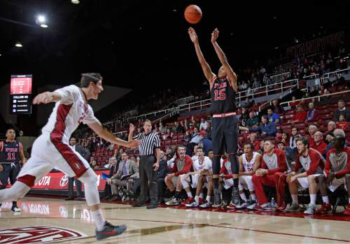 Utah guard Lorenzo Bonam (15) shoots over Stanford forward Rosco Allen, left, during the first half of an NCAA college basketball game Friday, Jan. 1, 2016, in Stanford, Calif. (AP Photo/Marcio Jose Sanchez)
