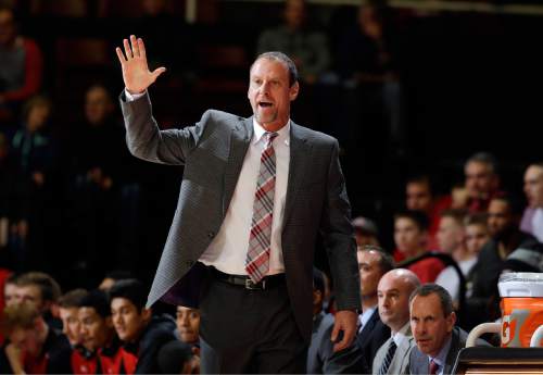 Utah head coach Larry Krystkowiak directs his team against Stanford during the first half of an NCAA college basketball game Friday, Jan. 1, 2016, in Stanford, Calif. (AP Photo/Marcio Jose Sanchez)