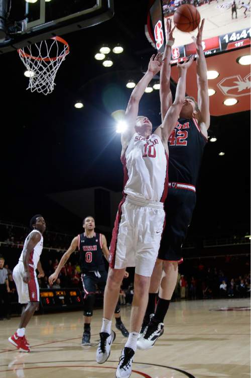 Utah forward Jakob Poeltl (42) battles for a rebound against Stanford forward Michael Humphrey (10) during the first half of an NCAA college basketball game Friday, Jan. 1, 2016, in Stanford, Calif. (AP Photo/Marcio Jose Sanchez)