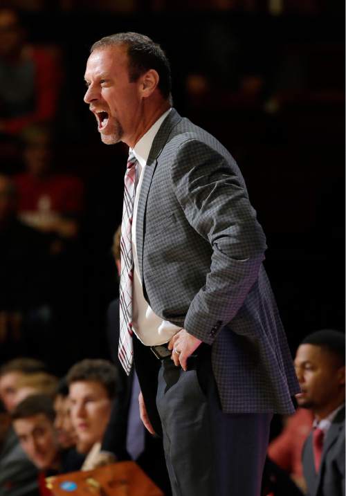Utah head coach Larry Krystkowiak argues a call during the second half of an NCAA college basketball game against Stanford on Friday, Jan. 1, 2016, in Stanford, Calif. Stanford won 70-68 in overtime. (AP Photo/Marcio Jose Sanchez)