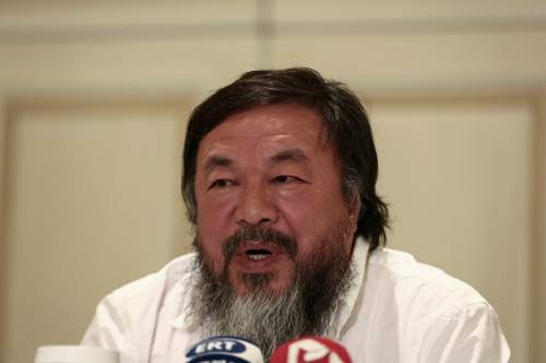 Chinese activist and artist Ai Weiwei addresses journalists during a news conference in Athens, Friday, Jan. 1, 2016. The Chinese artist visited the island of Lesbos is solidarity with refugees and migrants who continue to arrive on a daily basis hoping to make their way into Europe.   (AP Photo/Yorgos Karahalis)