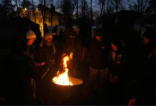 Migrants gather around a fire to warm themselves at the railway station in the southern Serbian town of Presevo, Wednesday, Dec. 23, 2015. As 2015 ends, boat-loads continue to reach the shores of Greek islands from the nearby Turkish coast, while thousands of migrants unlikely to receive refugee status are stranded along the Balkan migrant route, their hopes of reaching the prosperous northern EU countries in jeopardy. (AP Photo/Darko Vojinovic)