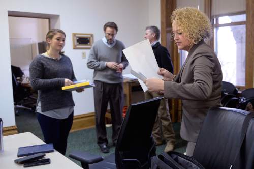 Al Hartmann  |  The Salt Lake Tribune
Mayor-elect Jackie Biskupski, right, gets down to business with members of her staff, Simone Butler, executive assistant, left, David Litvack, deputy chief of staff and Patrick Leary, chief of staff in her temporary fourth floor office in Salt Lake City Hall.