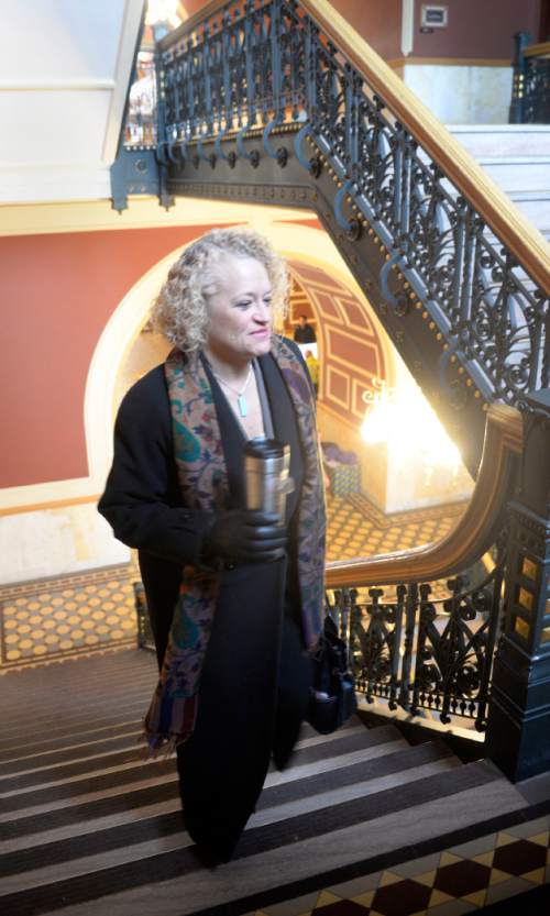 Al Hartmann  |  The Salt Lake Tribune
With coffee mug in hand, Mayor-elect Jackie Biskupski climbs stairs to her temporary fourth floor office in Salt Lake City Hall.