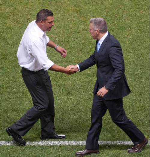 Michael Mangum  |  Special to the Tribune

Real Salt Lake head coach Jeff Cassar, left, and Sporting Kansas City head coach Peter Vermes shake hands following their match at Rio Tinto Stadium in Sandy, UT on Friday, July 24, 2015. Real Salt Lake defeated Sporting Kansas City 2-1.