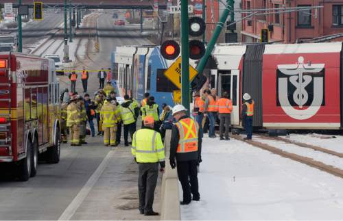 Al Hartmann  |  The Salt Lake Tribune
Emergency crews respond to a fatal car accident of driver at 600 West and North Temple when it collided with a TRAX train Monday Jan. 4.