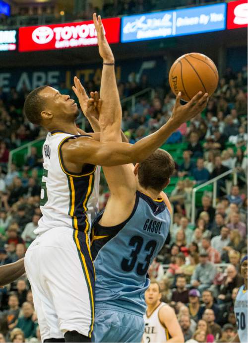 Rick Egan  |  The Salt Lake Tribune

Utah Jazz guard Rodney Hood (5) is fouled by Memphis Grizzlies center Marc Gasol (33), as the Jazz win 92-87, in overtime, in NBA action Utah Jazz vs. The Memphis Grizzlies in Salt Lake City, Saturday, January 2, 2016. Hood finished with 32 points.