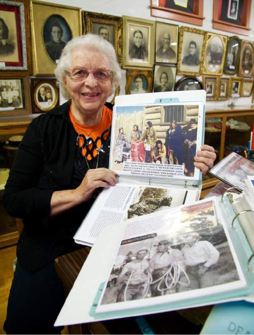 Lynn R. Johnson  |  Special to The Salt Lake Tribune

Kanab Heritage Museum curator Deanna Glover with one of many photo albums documenting film making in the Southern Utah town.  The museumís shelves are lined with scripts, many autographed, and is home to one of John Fordís director chairs, a recent gift.