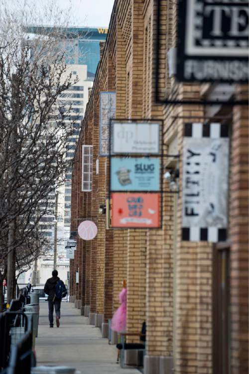Lennie Mahler  |  The Salt Lake Tribune

A man walks along the store fronts on Pierpont Avenue between 300 and 400 West in Salt Lake City, Friday, Feb. 27, 2015. The Eccles Browning Warehouse, a long-time home to small artisan businesses, was sold in January to an out-of-state residential developer.