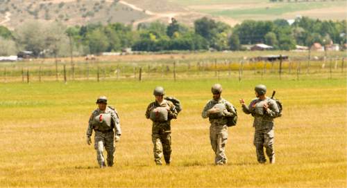 Rick Egan  |  The Salt Lake Tribune

National Guardmembers from 1st Battalion, 19th Special Forces walk back after a successful jump from a UH-60 Blackhawk helicopter as Utah Guard Special Forces Conduct Airborne Training in Ephraim, Thursday, August 14, 2014