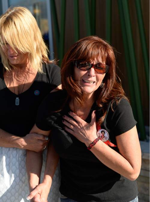 Francisco Kjolseth | The Salt Lake Tribune
Susan Hunt is overcome with emotion as she remembers her son's final walk. On the one-year anniversary of the death of Darrien Hunt at the hands of police, family, friends and supporters gathered to remember him in Saratoga Springs.