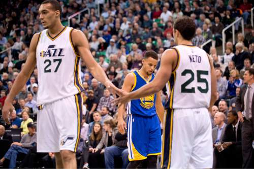 Lennie Mahler  |  The Salt Lake Tribune

Rudy Gobert and Raul Neto high five with Steph Curry in the background during a game between the Utah Jazz and Golden State Warriors at Vivint Smart Home Arena on Monday, Nov. 30, 2015.