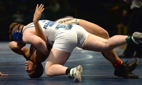 Steve Griffin  |  The Salt Lake Tribune

Wayne High School's Tava'e Pei arches his back as he tries to escape the hold of Pleadant Grove's Brandon Closson during the Simplii All-Star Dual, a premier preseason wrestling tournament, at Utah Valley University in Orem, Tuesday, January 5, 2016.