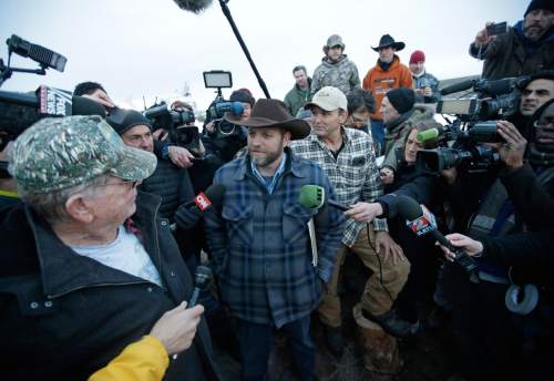 Rick Bowmer  |  The Associated Press
Ammon Bundy, one of the sons of Nevada rancher Cliven Bundy, speaks to reporters during a news conference at Malheur National Wildlife Refuge after meeting with Harney County Sheriff David Ward on Thursday, near Burns, Ore. Ward and two other Oregon sheriffs met Thursday with Bundy, the leader of an armed group occupying a federal wildlife refuge and asked them to leave, after residents made it clear they wanted them to go home.
