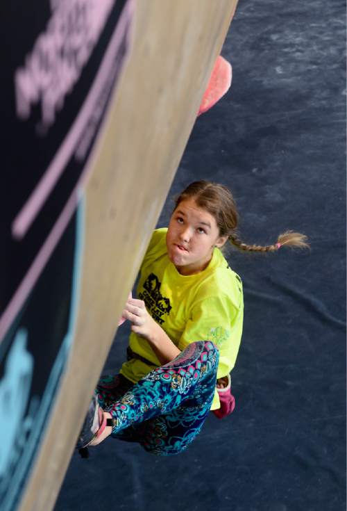 Scott Sommerdorf   |  The Salt Lake Tribune
Amalia Manning concentrates as she tries to reach the next hand hold while she competes during the American Bouldering Series (ABS) Divisional Championships at The Front Climbing Club in Ogden, Saturday, January 9, 2016.