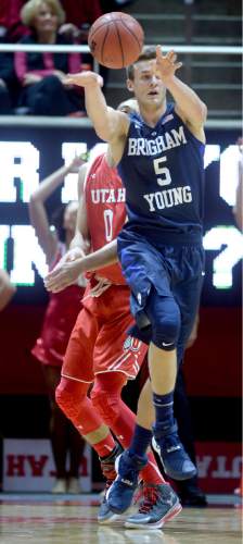 Steve Griffin  |  The Salt Lake Tribune

Brigham Young Cougars guard Kyle Collinsworth (5) passes the ball during first half action in the Utah versus BYU men's basketball game at the Huntsman Center in Salt Lake City, Wednesday, December 2, 2015.