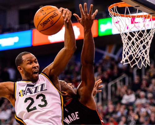 Trent Nelson  |  The Salt Lake Tribune
Miami Heat guard Dwyane Wade (3) puts up a shot, only to be blocked by Utah Jazz forward Chris Johnson (23) as the Utah Jazz host the Miami Heat, NBA basketball in Salt Lake City, Saturday January 9, 2016. Utah Jazz center Jeff Withey (24) at rear.