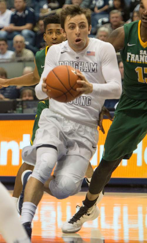 Rick Egan  |  The Salt Lake Tribune

Brigham Young Cougars guard Nick Emery (4) takes the ball up the middle, in basketball action BYU vs. San Francisco, at the Marriott Center, Saturday, January 9, 2015.