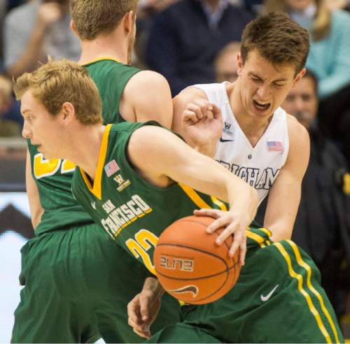 Rick Egan  |  The Salt Lake Tribune

San Francisco Dons guard Tim Derksen (32) screens out Brigham Young Cougars guard Zac Seljaas (2), as San Francisco Dons forward Chase Foster (22) goes to the basket, in basketball action BYU vs. San Francisco, at the Marriott Center, Saturday, January 9, 2015.